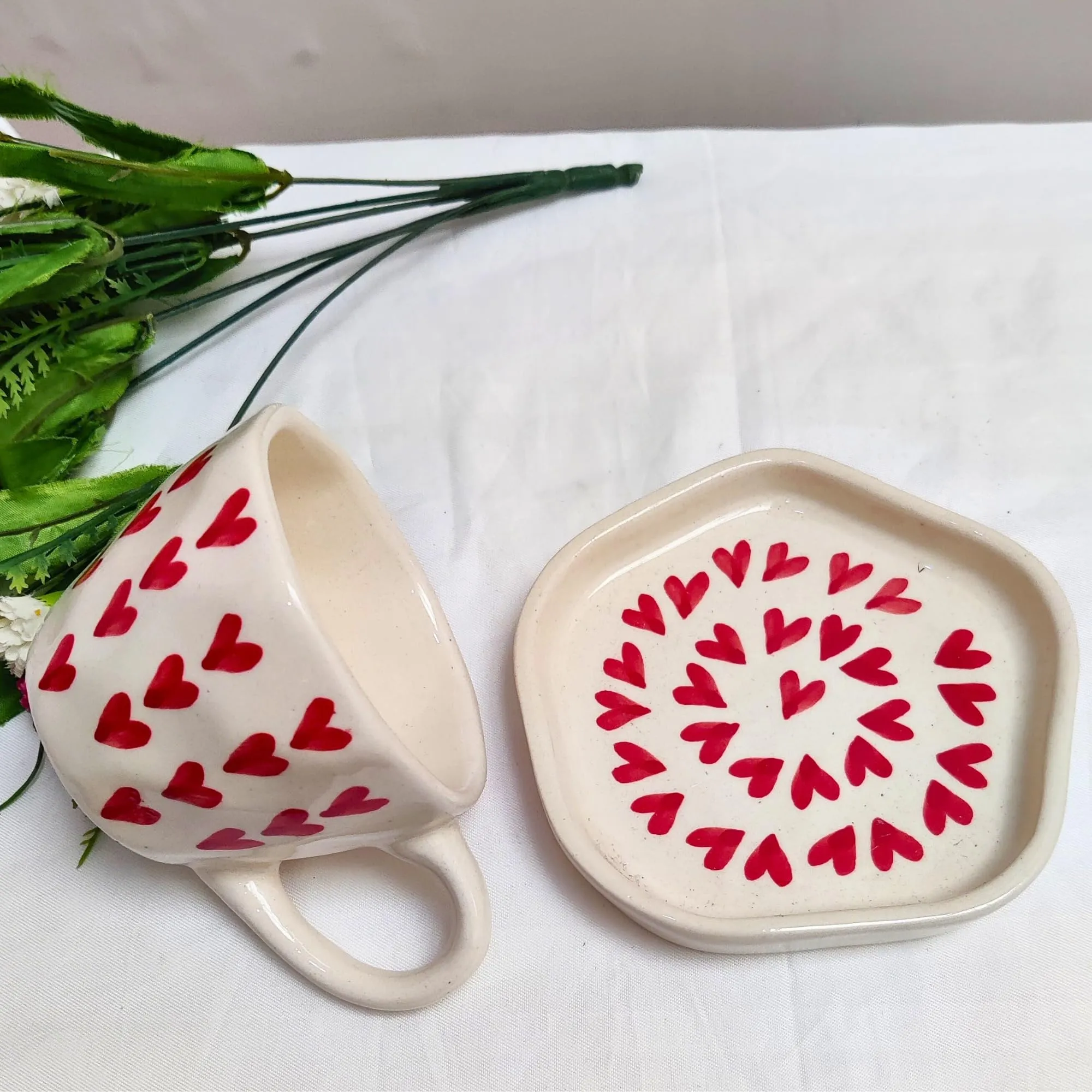 DIVYAKALAA Handpainted Ceramic Tea Cup & Saucer Set || 300 mL, Microwave and Dishwasher Safe || Ceramic Tea Cups (Red Hearts) || Tea Cup Coffee Mug Gift and Special Occasions